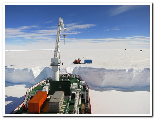 the Agulhas powering the last few meters through the thick pack ice to within 3 meters of the ice shelf